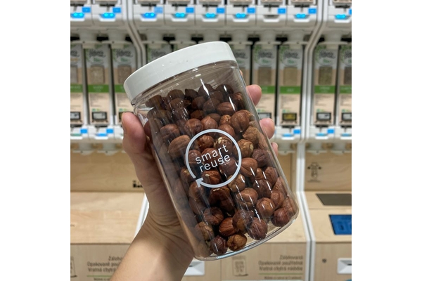 Hazelnuts in reusable jar in supermarket.
